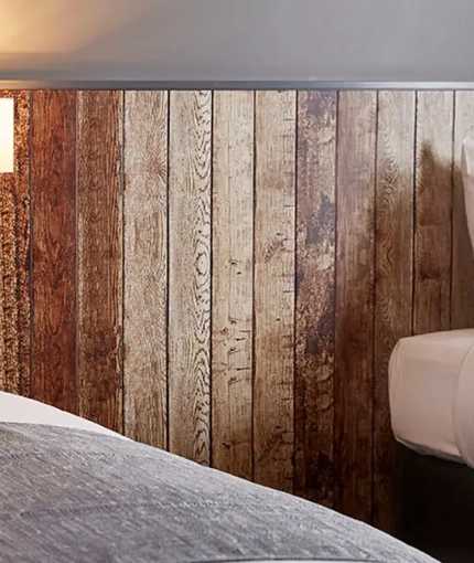 The interior of one of the hotel rooms featuring twin single beds at The Churchill.