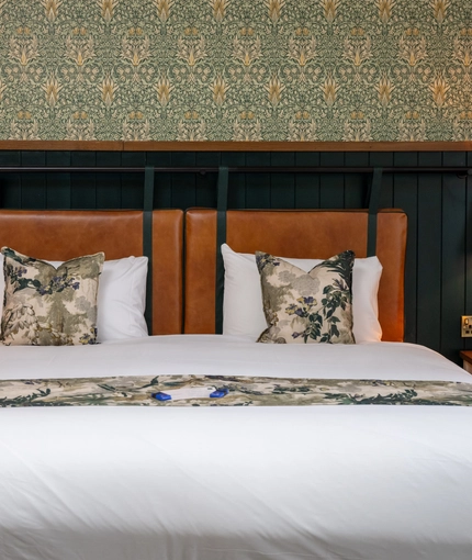 A bed in one of the hotel rooms at Himley House.