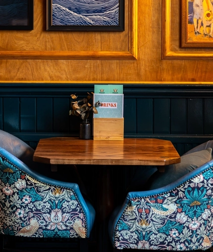 The interior restaurant seating area and decor at The Sussex Arms.