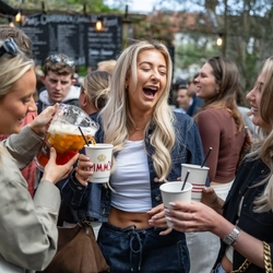 An image of a group of people stood outside with drinks during the Boat race event at The Crabtree.
