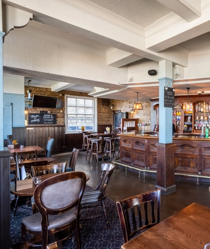interior bar with seating area and restaurant