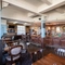 interior bar with seating area and restaurant