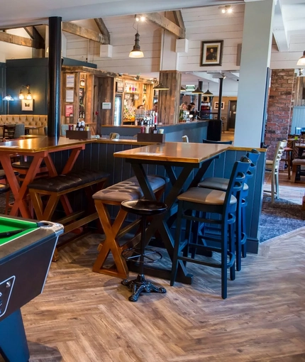 The restaurant area and a pool table inside The Sail Makers.