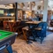 The restaurant area and a pool table inside The Sail Makers.