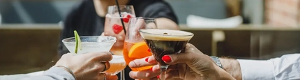 a group of people holding a wine glass