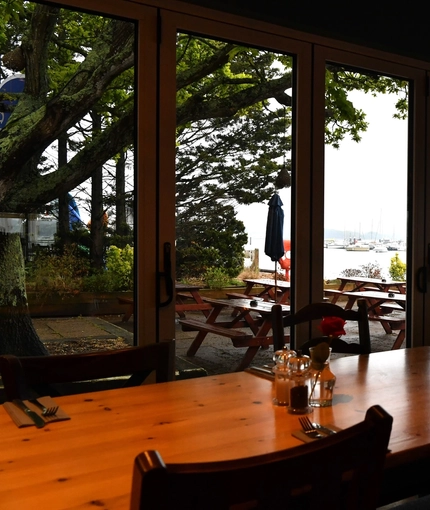 Interior waterfront dining area of a pub.
