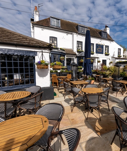 Exterior of the pub with the beer garden in show