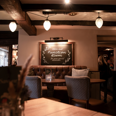 The interior restaurant seating area with chalkboard advertising the Function Room hire at The Blue Cap.