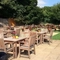 The exterior beer garden seating area with children's play area at The Spread Eagle.