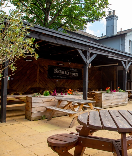 A beer garden outside of a pub