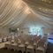 A marquee, decorated for a wedding.