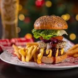 a beyond meat burger sitting at a table of a pub