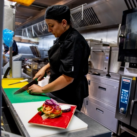 A person working in a kitchen.