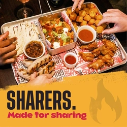 A banner promoting 'summer sharers' available at Flaming Grill venues.