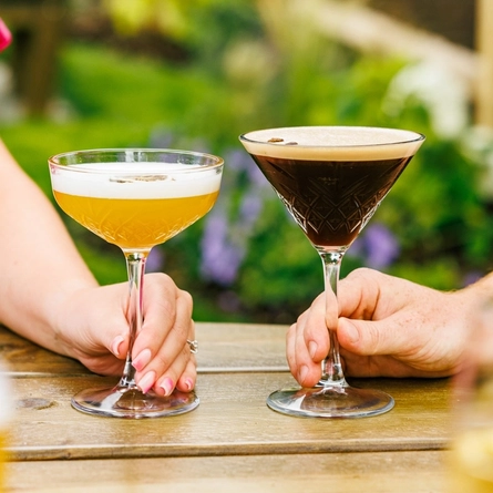 A close up of two martini glasses