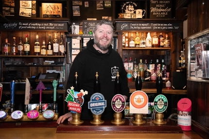 A photo of Karl behind the bar of Ye Olde Trip to Jerusalem.