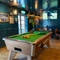 The interior restaurant seating area of the Cock & Pye, with a pool table, and a TV on the wall.