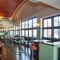 Interior of bar with high tables and bar stools surrounding