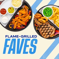 Promotional banner featuring the text “Flame-Grilled Faves” alongside two sizzling platter meals on a light beige background with blue chevron graphics. One platter contains seasoned chicken strips with grilled peppers, shredded cheese, guacamole, salsa and sour cream, while the other features a flame-grilled pork chop served with chips, peas, onion rings and a grilled tomato.