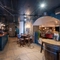The bar in the Prince Of Wales, and some tables near to it.