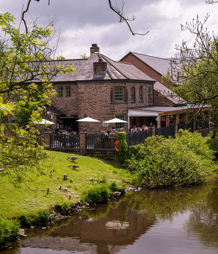 The exterior of The Malthouse Farm and the grounds surrounding it.