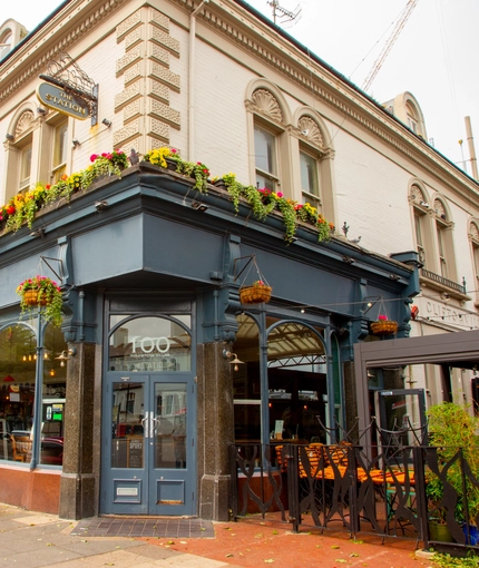 External view of a pub entrance and beer garden