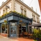 External view of a pub entrance and beer garden