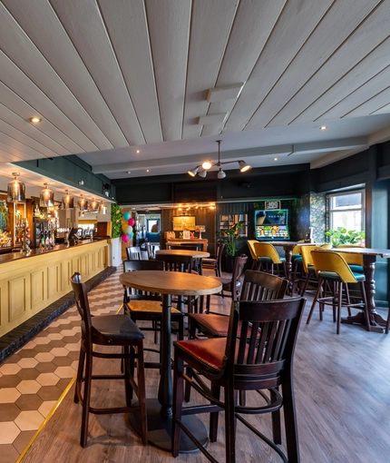 Interior bar and seating area of the Cricketers pub in Southwick