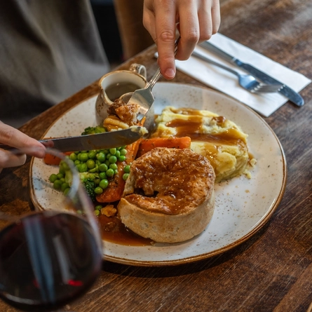 A served main of steak and ale pie served at Chef and Brewer venues.