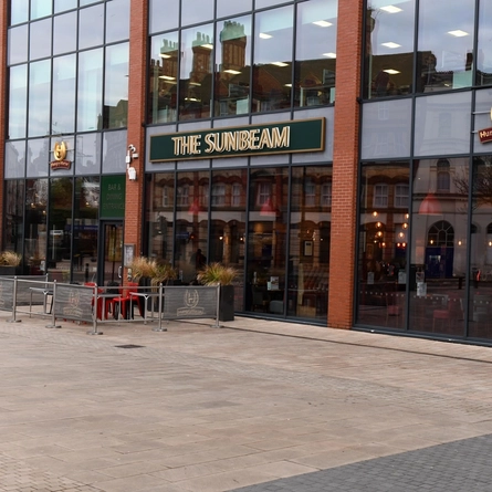 The exterior facade and outdoor seating area at The Sunbeam.