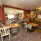 Interior dining area of a pub with a TV.