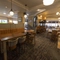 Interior dining area of a pub with a TV.