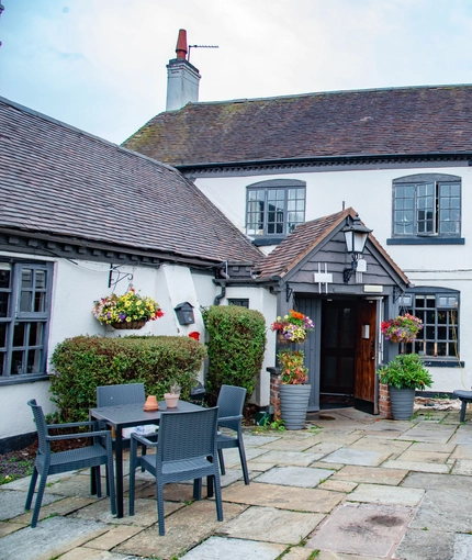 The exterior and beer garden of The Nags Head.