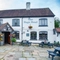 The exterior and beer garden of The Nags Head.