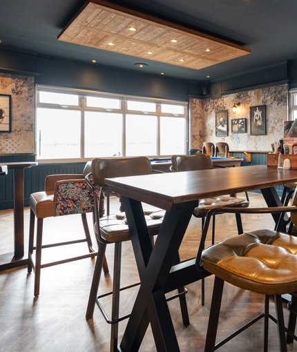 The restaurant area of the Cocked Hat, with a TV on the wall.