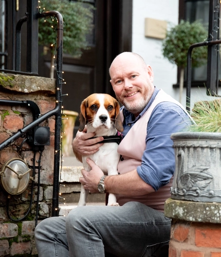 GM with a dog outside the pub