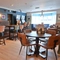 The interior restaurant seating area with TV and electronic pub games at The Greengage.