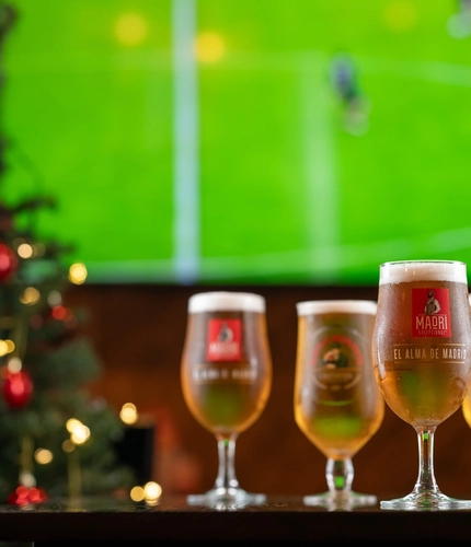 pints of beer in front of a TV