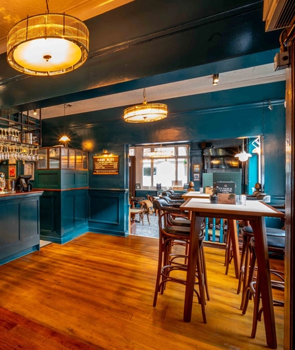 The bar and interior restaurant seating area of the Lucas Arms in London.