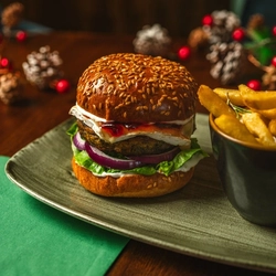 A Festive main of Camembert Cranberry Falafel Burger served in the restaurant at a Community Food venue.