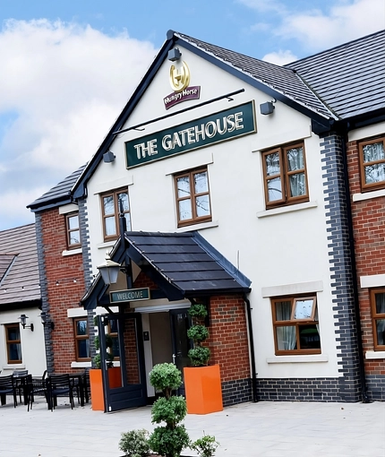 The exterior facade and seating area at The Gatehouse.
