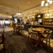 Interior dining area of a pub with a bar.