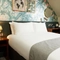 A bed in a hotel room of The Narborough Arms.