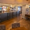 Interior dining area of a pub with a bar.