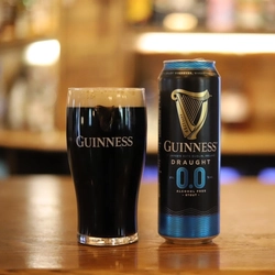 A can of Guinness 0% and a full pint glass