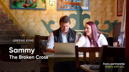 A video cover banner showing 2 people sat at a table looking at a laptop within the interior seating area for Pub Partners.