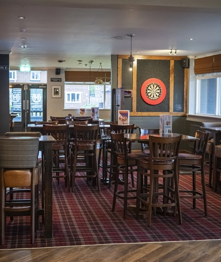 interior of restaurant and seating area with pub games