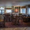 interior of restaurant and seating area with pub games