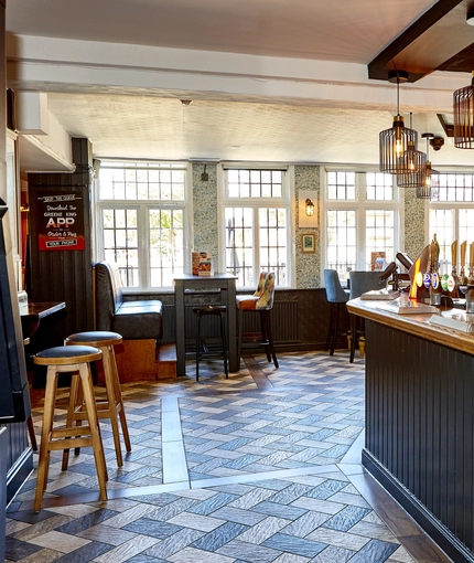 The bar and interior restaurant seating area at The Good Intent in Hornchurch.