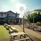 Exterior facade and beer garden of a pub with a seating area.